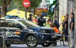 Des policiers et secouristes près du site d'un bâtiment effondré à Madrid, le 7 octobre 2025 en Espagne