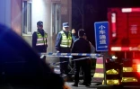 Des agents de sécurité devant l'entrée de la mine de charbon de Liushenyu, dans le nord-est de la Chine, le 23 mai 2026