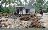 Des maisons détruites dans le village de Kannapanakundu, dans l'état indien du Kerala, le 18 août 2018