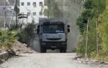 Un camion du Croissant rouge syrien dans Daraya avec un convoi d'aide humanitaire le 1er juin 2016
