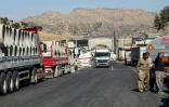 Des chauffeurs de camion iraniens attendent de pouvoir repasser la frontière iranienne dans le district de Penjwen, près de la frontière avec l'Iran, dans la région autonome du Kurdistan irakien, le 21 septembre 2026