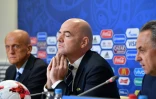 Le président de la Fifa Gianni Infantino, avec le patron des arbitres Pierluigi Collina et le Russe Vitali Moutko, le 1er juillet 2017 à Saint-Pétersbourg