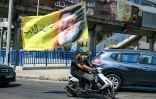 Des partisans du Hezbollah brandissent le portrait du leader historique du mouvement assassiné par Israël, Hassan Nasrallah, à l'occasion de l'Achoura, journée de deuil pour la mort de Hussein, figure clé de l'islam chiite,à Beyrouth, le 26 juin 2026 