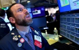Un trader à l'ouverture de la Bourse de New York le 13 mars 2020