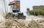 Des unités antiterroristes irakiennes patrouillent dans les rues de Falloujah reprises des mains du groupe EI, le 23 juin 2016