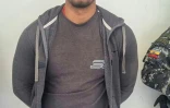 Photo de la police équatorienne montrant l'arrestation de Carlos L. alias "El Gringo", chef de la dissidence des FARC colombiennes du Front Oliver Sinisterra, à Imbabura, en Equateur, le 22 janvier 2024