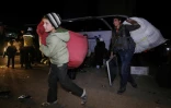Des Syriens évacués de la Ghouta orientale dans la localité de Qalaat al-Madiq le 31 mars 2018