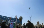Des manifestants syriens rassemblés à Damas pour le 14e anniversaire du soulèvement populaire de 2011, le 15 mars 2025