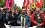 Le secrétaire général de la CGT Philippe Martinez (2D) lors d'une manifestation contre les réformes du président Macron le 12 septembre 2017