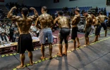 Des culturistes afghans participent au concours de Mr Afghanistan, le 10 juillet 2024 à kaboul