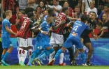 Joueurs marseillais et niçois s'accrochent avec un suppprter de l'OGC Nice lors du match disputé, puis interrompu à l'Allianz Riviera, le 22 août 2021 