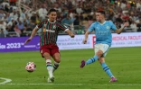 L'attaquant de Manchester City Phil Foden (d) face au milieu de Fluminense Ganso en finale du Mondial des clubs, le 22 décembre 2023 à Jeddah