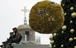 Des membres des forces de l'ordre palestiniens à Bethléem, sur les Territoires palestiniens, à côté de l'Eglise de la nativité, construite sur le site où Jésus-Christ est né selon la tradition chrétienne, le 24 décembre 2016