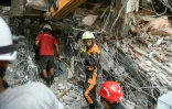 Des secouristes recherchent des survivants dans les décombres, le 29 mars 2025 à Mandalay (centre), près de l'épicentre du séisme qui a frappé la veille la Birmanie