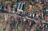 Image satellite diffusée par la société Maxar Technologies le 4 avril 2022, montrant des habitations et des véhicules détruits à Boutcha (Ukraine) le 31 mars 2022