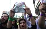 Des partisans du président Hassan Rohani fêtent sa victoire à Téhéran, le 20 mai 2017