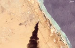 Image satellite diffusée par Planet Labs PBC, datée du 5 mai 2025, montrant des volutes de fumée après une attaque sur Port-Soudan, au Soudan
