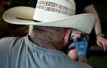 Kyle Walker travaille sur un tatouage lors du festival Country to Country (C2C), le 13 mars 2026 à Londres