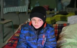 Daniel, 13 ans, qui vit avec ses parents dans un parking souterrain Ă l'abri des bombes, le 24 avril 2022 Ă Kharkiv, en Ukraine