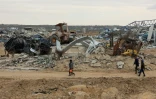 Des Palestiniens traversent le corridor de Netzarim après le retrait des forces israéliennes, le 9 février 2025