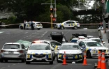 Des policiers près des lieux d'une fusillade dans le centre d'Auckland, le 20 juillet 2023 en Nouvelle-Zélande