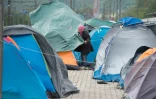 Des réfugiés dans un camp le 4 mai 2016 à Idomeni en Grèce
