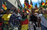 Leaders sociaux et des défenseurs des droits issus de différentes communautés colombiennes, afro-descendants, indigènes et paysans participent à une marche du 1er mai à Bogota le 1er mai 2019