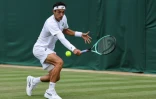 L'Italien Lorenzo Musetti contre le Géorgien Nikoloz Basilashvili à Wimbledon près de Londres le 1er juillet 2025 
