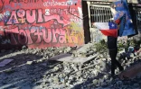 Un mur recouvert de l'inscription "Ici on torture" Ă Santiago du Chili le 1er novembre 2019