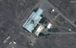 Une image satellite diffusée par Planet Labs montre un bâtiment endommagé de l'usine de fabrication de missile Bid Kaneh, au sud de Téhéran le 15 juin 2025
