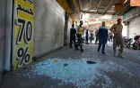 Les forces de sécurité syriennes sont rassemblées sur les lieux d'une explosion survenue dans un café de la capitale, Damas, le 2 juillet 2026