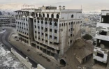 Vue aérienne du bâtiment d'un ancien hôpital de campagne utilisé pendant la guerre civile syrienne, à Douma, à l'est de Damas, le 22 décembre 2024