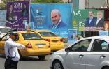 Des affiches de candidats aux élections législatives irakiennes dans une rue de Bagdad, le 19 avril 2018