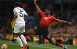 Le Brésilien Marquinhos face au Français Paul Pogba lors du match de Ligue des champions entre Manchester United et le PSG, le 12 février 2019 à Old Trafford
