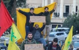 Des partisans du mouvement chiite du Hezbollah, au 9e jour d'une mobilisation inédite contre la classe politique qui paralyse le Liban, le 25 octobre 2019 à Beyrouth