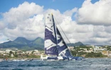 Le trimaran "Maxi Edmond de Rothschild" (classe Ultime), barré par les skippers français Franck Cammas et Charles Caudrelier, franchit, en vainqueur, la ligne d'arrivée de la Transat Jacques Vabre, le 23 novembre 2021 à Fort-de France