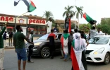 Des manifestants brandissent des drapeaux du Soudan, le 3 août 2019 à Khartoum