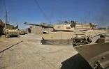 Les blindés de l'armée et des unités paramilitaires du Hachd al-Chaabi avançent dans Tal Afar, le 23 août 2017