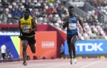 Le Français Mouhamadou Fall (d) lors de sa série du 200 m aux Mondiaux de Doha, le 29 septembre 2019