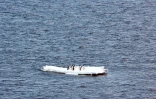 Un groupe de manchots sur un morceau de banquise de l'Antarctique, (photo fournie par le "Pew Charitable Trust" le 25 avril 2017)