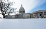 De la neige sur le Capitole américain à Washington, le 31 janvier 2026