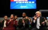 Boris Johnson au côté de la ministre de l'Intérieur Priti Pate lors de la conférence annuelle des conservateurs à Manchester le 4 octobre 2021 