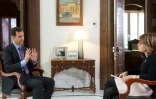 Une capture d'écran fournie par la SANA le 6 décembre 2015 du président syrien Bachar al-Assad  lors d'un interview avec une journaliste du Sunday Times à Damas, le 6 décembre 2015