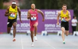 Le champion olympique du 100 m, l'Italien Marcell Jacobs (c) remporte la finale lors des Championnats d'Italie, le 25 juin 2022 à Rieti