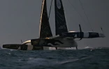 Le skipper français Charles Caudrelier, à bord de son multicoque Maxim Edmond de Rothschild, franchit la ligne d'arrivée et remporte l'Ultim Challenge, course à la voile en solitaire autour du monde, au large de Brest, le 27 février 2024