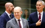 Le chancelier allemand Olaf Scholz (c), le président du Conseil européen Charles Michel (g) et le secrétaire général de l'Otan Jens Stoltenberg (d), le 29 juin 2023 à Bruxelles