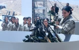 Des combattangs du PKK rendent leurs armes lors d'une cérémonie à Souleimaniyeh, au Kurdistan irakien, le 11 juillet 2025