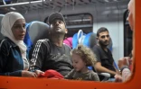 Des migrants et réfugiés à bord d'un train, près de Tovarnik, le 17 septembre 2015 en Croatie, près de la frontière avec la Serbie