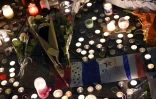 Bougies et fleurs près du Bataclan pour les victimes des attentats, à Paris le 14 mai 2015