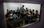 Des cours sont dispensés dans des salles de classe souterraines à l'école Al-Hayat, dans un quartier nord de Damas, le 19 octobre 2016